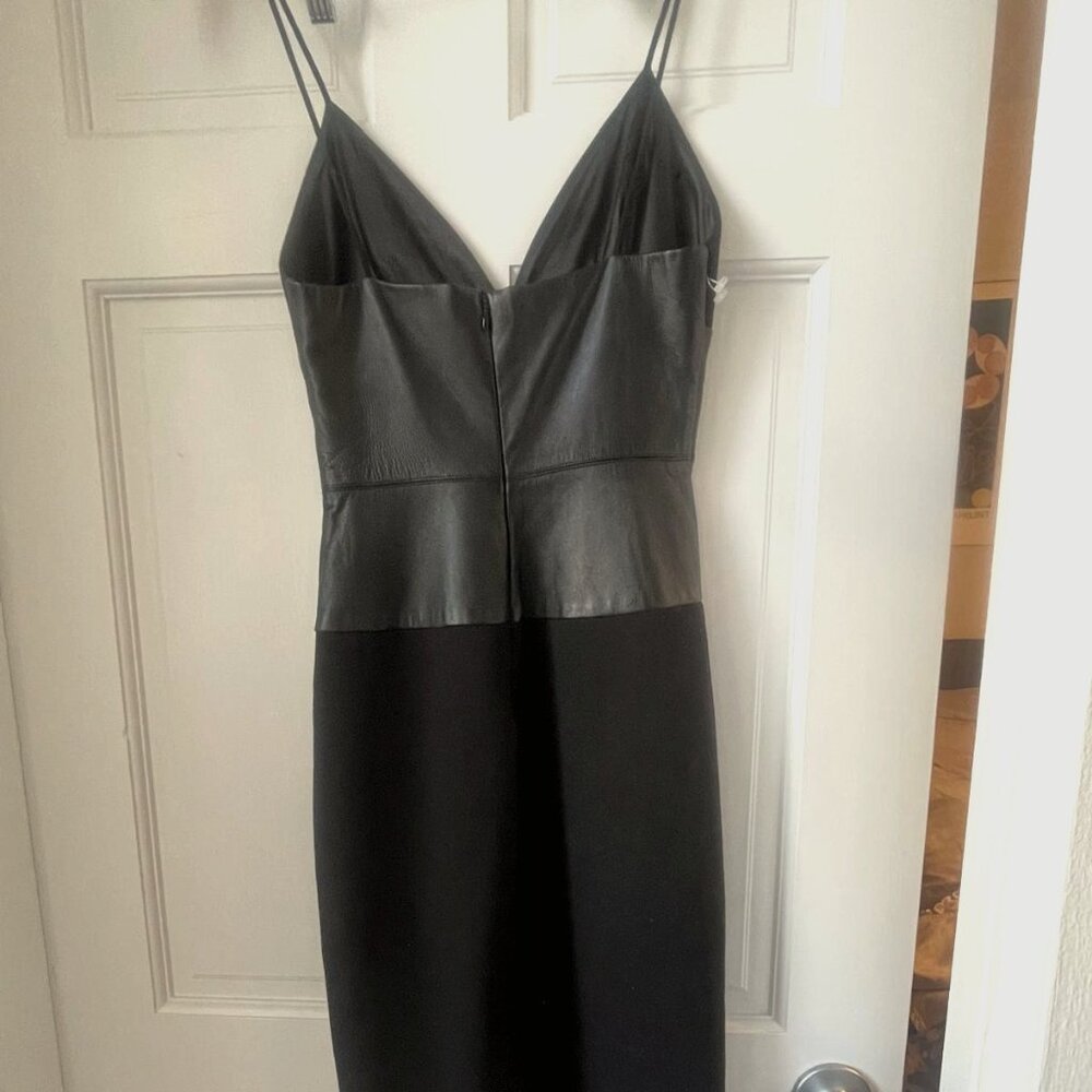 Black, spaghetti strap dress with lamb skin trim